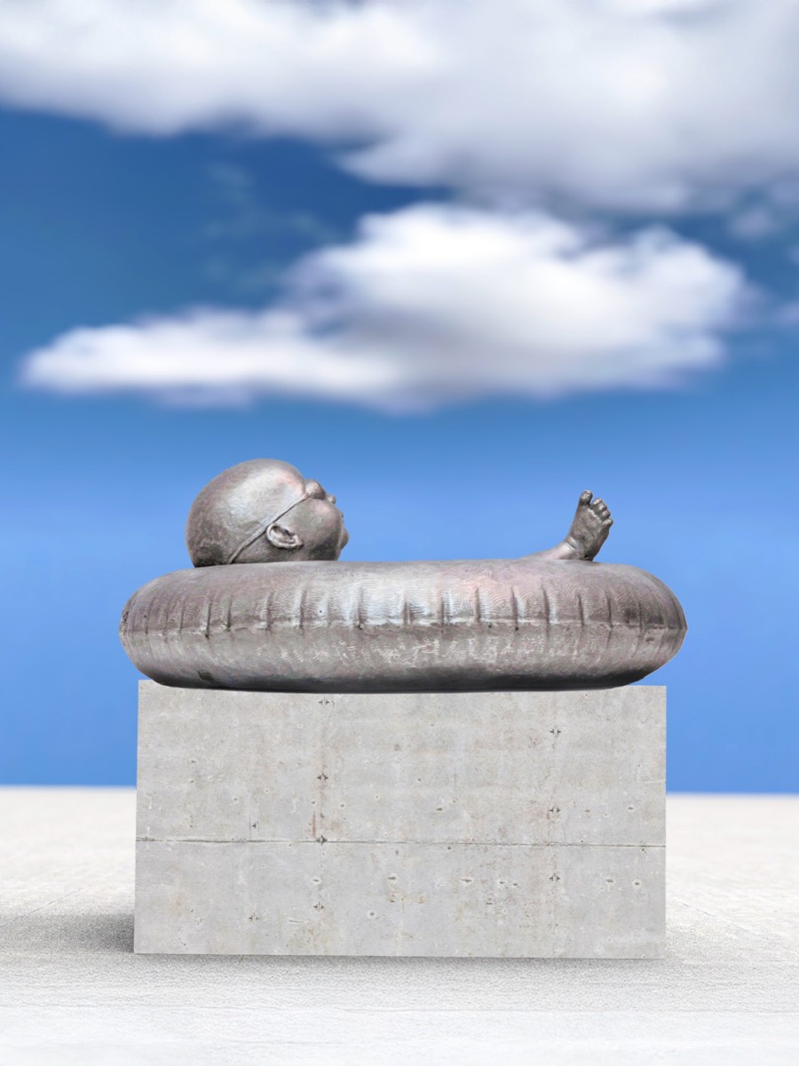 narrative figurative stainless steel sculpture of child resting on inner tube by Richard Becker