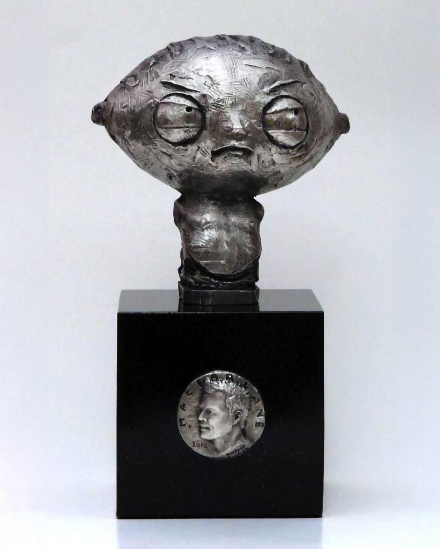 Stewie Griffin sculpture with bas-relief portrait medallion of Seth MacFarlane incorporated into the pedestal