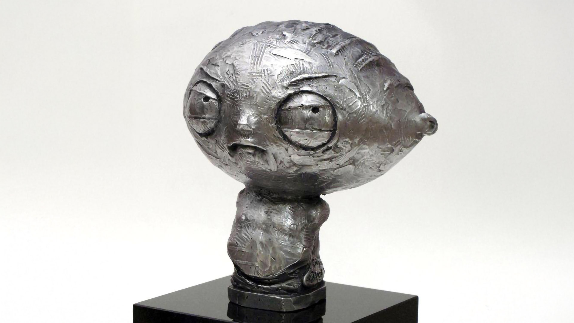 Stewie Griffin sculpture created by Richard Becker for Seth MacFarlane, stainless steel portrait sculpture on granite pedestal